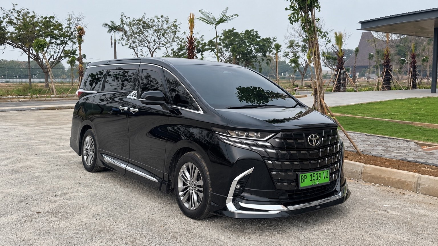 Black Toyota Alphard Gen 4, full vehicle in landscape view.