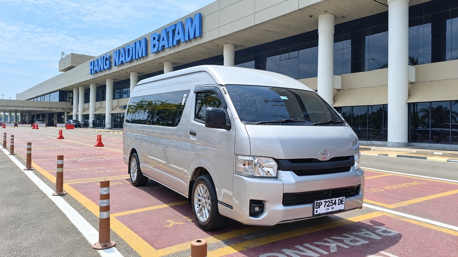 Silver Toyota Hiace Commuter at Hang Nadim Airport, Batam.